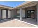 Covered patio featuring gray siding and black sliding doors with windows at 2633 Pickett Downs Dr, Chuluota, FL 32766