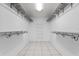 Walk-in closet with shelving and tile flooring at 2633 Pickett Downs Dr, Chuluota, FL 32766