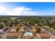 Expansive aerial view showcasing the community layout, pool, and surrounding lush landscape and lakes at 2818 Plaza Terrace Dr # 2818, Orlando, FL 32803