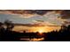 Beautiful sunset view over water displaying vibrant colors and natural scenic charm at 2818 Plaza Terrace Dr # 2818, Orlando, FL 32803