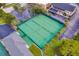 Overhead view of tennis courts with ample parking and green surroundings in a desirable community at 303 S Sweetwater Blvd, Longwood, FL 32779