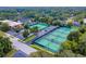 Aerial view of community tennis courts offering ample recreational space and amenities at 303 S Sweetwater Blvd, Longwood, FL 32779