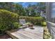Secluded backyard deck area with cozy seating for outdoor relaxation at 303 S Sweetwater Blvd, Longwood, FL 32779