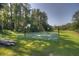 Enjoy a game of basketball at this community's outdoor court surrounded by lush greenery at 303 S Sweetwater Blvd, Longwood, FL 32779