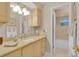 Well-lit bathroom with a large vanity, ample counter space, and a clean, neutral color palette at 303 S Sweetwater Blvd, Longwood, FL 32779