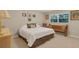 Charming bedroom featuring a comfortable bed, natural light and a ceiling fan at 303 S Sweetwater Blvd, Longwood, FL 32779