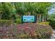 A lush welcome to Riverbend Park shows vibrant landscaping and a sign near a beautiful community at 303 S Sweetwater Blvd, Longwood, FL 32779