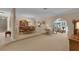 Spacious dining room featuring carpeted floors, archways, and elegant chandelier at 303 S Sweetwater Blvd, Longwood, FL 32779