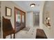 Inviting entryway with tile floors, glass paneled doors, and neutral color scheme at 303 S Sweetwater Blvd, Longwood, FL 32779