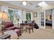 Bright office space with large windows and a comfortable seating area at 303 S Sweetwater Blvd, Longwood, FL 32779