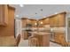 Beautiful kitchen with granite countertops, stainless steel appliances, and a center island with seating at 303 S Sweetwater Blvd, Longwood, FL 32779