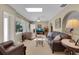 Inviting living room with large windows, comfortable seating, and a relaxing atmosphere at 303 S Sweetwater Blvd, Longwood, FL 32779