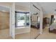 Bright main bedroom featuring large windows, plush carpeting, and a spacious closet at 303 S Sweetwater Blvd, Longwood, FL 32779