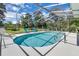 Inviting screened-in pool with blue tile and a spacious deck for lounging at 303 S Sweetwater Blvd, Longwood, FL 32779