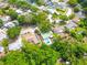 Aerial view of home showcasing green roof, pool, landscaping, and surrounding neighborhood at 3054 Bluebrook Dr, Winter Park, FL 32792