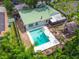 Aerial view of backyard featuring a private pool, patio, and lush landscaping at 3054 Bluebrook Dr, Winter Park, FL 32792