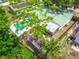 Aerial view showing the backyard pool, patio, and surrounding landscaping and fence at 3054 Bluebrook Dr, Winter Park, FL 32792