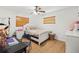 Cozy bedroom featuring natural light, a ceiling fan, and neutral decor at 3054 Bluebrook Dr, Winter Park, FL 32792