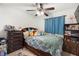 Comfortable bedroom with a ceiling fan, and decor that creates a warm and welcoming atmosphere at 3054 Bluebrook Dr, Winter Park, FL 32792
