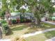 Inviting single Gathering home featuring a green metal roof and a spacious front yard at 3054 Bluebrook Dr, Winter Park, FL 32792