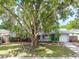 Charming single story home with mature tree, lovely landscaping, and covered front entrance at 3054 Bluebrook Dr, Winter Park, FL 32792
