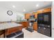 Well-lit kitchen featuring granite countertops, stainless steel appliances, and wood cabinets at 3054 Bluebrook Dr, Winter Park, FL 32792