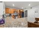 Spacious kitchen featuring granite countertops, wood cabinets and stainless steel appliances at 3054 Bluebrook Dr, Winter Park, FL 32792