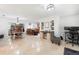 Open-concept living area with tile floors connecting to the kitchen and dining space at 3054 Bluebrook Dr, Winter Park, FL 32792