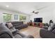 Open living room featuring hardwood floors, lots of natural light, and comfortable seating at 3054 Bluebrook Dr, Winter Park, FL 32792