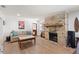 Cozy living room with hardwood floors, a brick fireplace, and comfortable seating at 3054 Bluebrook Dr, Winter Park, FL 32792