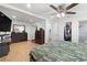 Bright main bedroom featuring wood floors, a ceiling fan, a closet and a shower room at 3054 Bluebrook Dr, Winter Park, FL 32792