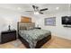 Spacious main bedroom features a ceiling fan, two windows and wood flooring at 3054 Bluebrook Dr, Winter Park, FL 32792