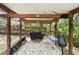 Enjoy outdoor cooking in this covered outdoor kitchen area, perfect for entertaining guests and Gathering at 3054 Bluebrook Dr, Winter Park, FL 32792
