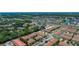Expansive aerial view of a well-planned community with lush landscaping, multiple buildings and beautiful surroundings at 3112 Seaview Castle Dr, Kissimmee, FL 34746