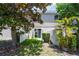 Well-maintained backyard with green grass, privacy fence, and tropical foliage at 3112 Seaview Castle Dr, Kissimmee, FL 34746