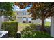Fenced backyard with a lush lawn, mature trees, and patio space perfect for outdoor living at 3112 Seaview Castle Dr, Kissimmee, FL 34746