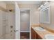 Bright bathroom featuring a shower and tub combo, plus a vanity with double sinks and a walk-in closet at 3112 Seaview Castle Dr, Kissimmee, FL 34746