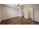 Spacious bedroom with hardwood floors, closet and door to bathroom, offering both comfort and convenience at 3112 Seaview Castle Dr, Kissimmee, FL 34746