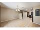 Bright dining area with stairs, tile floors, and easy access to the kitchen, creating an open layout at 3112 Seaview Castle Dr, Kissimmee, FL 34746