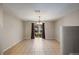 Bright dining room with tile floors, modern light fixture, and sliding glass doors to the backyard at 3112 Seaview Castle Dr, Kissimmee, FL 34746