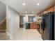 Spacious kitchen featuring tile flooring, ample cabinet space, and modern appliances at 3112 Seaview Castle Dr, Kissimmee, FL 34746