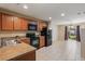 Functional kitchen features a sink, appliances, and access to the dining area at 3112 Seaview Castle Dr, Kissimmee, FL 34746