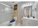 Bathroom featuring shower with sliding glass door, vanity, mirror, and tile flooring at 325 Aldridge Ln, Davenport, FL 33897