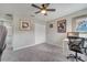 This bedroom features neutral walls, carpet, ceiling fan, and closet for a comfortable living space at 325 Aldridge Ln, Davenport, FL 33897