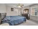 Bedroom with carpet, window, ceiling fan, and dresser at 325 Aldridge Ln, Davenport, FL 33897