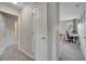 The hallway features neutral walls and carpet, providing access to various rooms in the home at 325 Aldridge Ln, Davenport, FL 33897