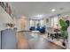 Open-concept living and dining area with stylish decor and natural lighting at 325 Aldridge Ln, Davenport, FL 33897