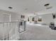 Spacious loft with a ceiling fan, multiple windows, and plush carpeting for versatile use at 325 Aldridge Ln, Davenport, FL 33897