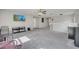 Expansive loft area featuring a ceiling fan, plush carpeting, and ample space for various activities at 325 Aldridge Ln, Davenport, FL 33897