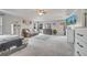 Spacious main bedroom with a tray ceiling, soft carpeting, and ample natural light, creating a relaxing retreat at 325 Aldridge Ln, Davenport, FL 33897